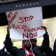 Tyreik Jackson protests outside Barneys New York’s flagship store, accusing the retailer of racial profiling, on Oct. 30, 2013, in New York City.
Andrew Burton/Getty Images